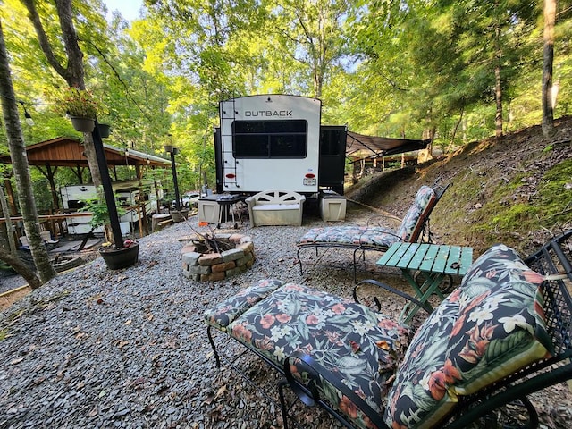 view of patio with a fire pit