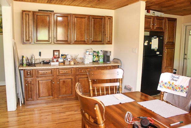 64 Cloe Moore Dr, Murphy, NC 28906 - kitchen featuring freestanding refrigerator, wood ceiling, light wood-style flooring, light countertops, and brown cabinetry