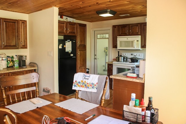 64 Cloe Moore Dr, Murphy, NC 28906 - kitchen featuring white appliances, wood ceiling, and light countertops