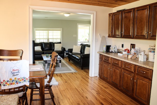 64 Cloe Moore Dr, Murphy, NC 28906 - kitchen featuring light wood-style flooring, dark brown cabinetry, and crown molding