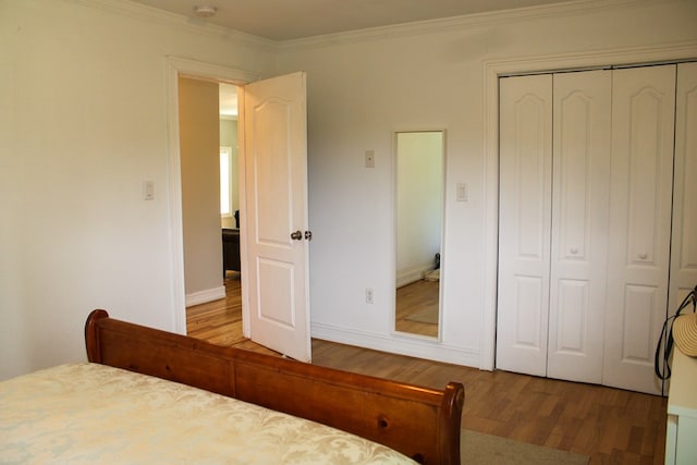 64 Cloe Moore Dr, Murphy, NC 28906 - unfurnished bedroom featuring wood finished floors, ornamental molding, a closet, and baseboards