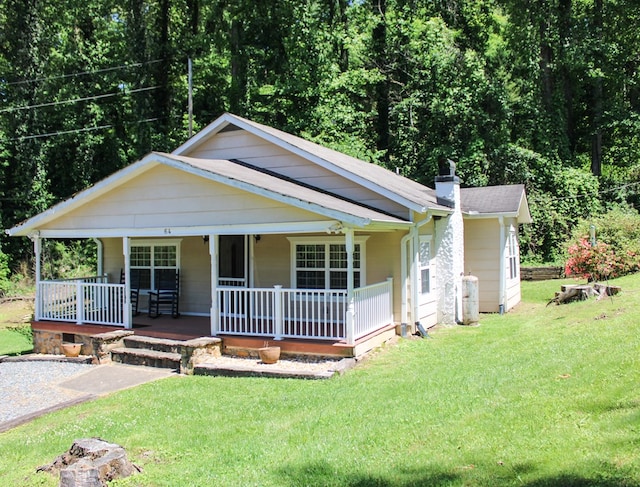 64 Cloe Moore Dr, Murphy, NC 28906 - bungalow with covered porch, a front yard, and a chimney