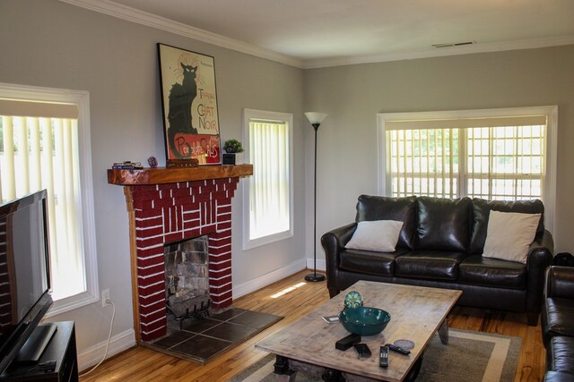 64 Cloe Moore Dr, Murphy, NC 28906 - living area featuring a fireplace, wood finished floors, crown molding, and baseboards