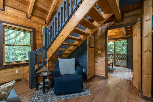 121 Farmstead Rd, Ellijay, GA 30540 - sitting room with wooden walls, wood ceiling, stairway, and hardwood / wood-style floors