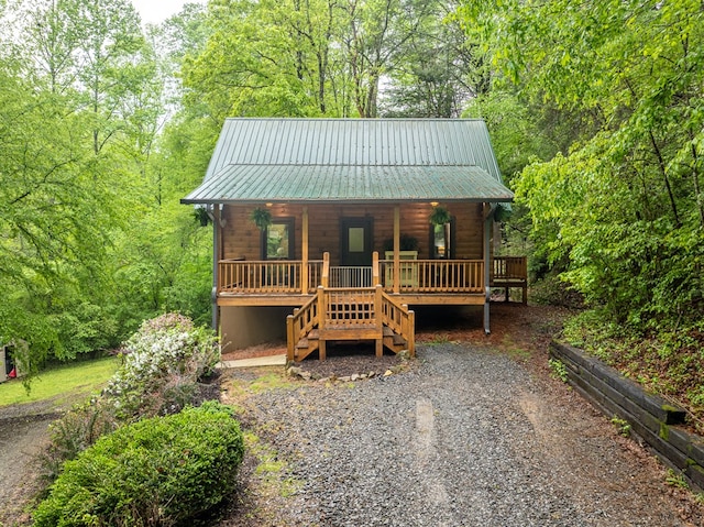 121 Farmstead Rd, Ellijay, GA 30540 - rustic home featuring a porch, stairs, and metal roof