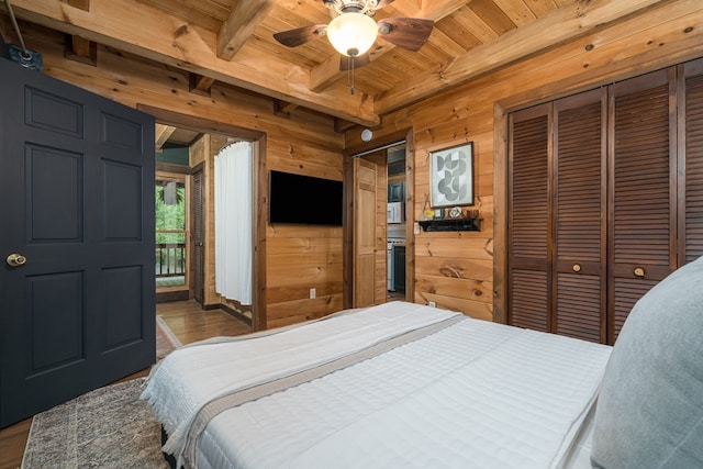 121 Farmstead Rd, Ellijay, GA 30540 - bedroom featuring wood walls, wood finished floors, beamed ceiling, access to outside, and wooden ceiling