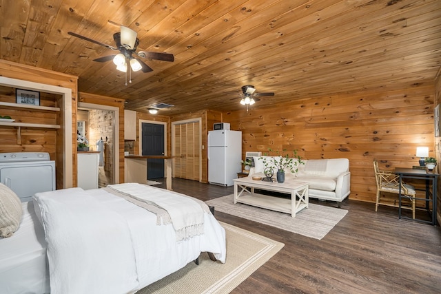 121 Farmstead Rd, Ellijay, GA 30540 - bedroom featuring wooden walls, washing machine and clothes dryer, freestanding refrigerator, wooden ceiling, and wood finished floors