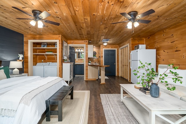 121 Farmstead Rd, Ellijay, GA 30540 - bedroom featuring freestanding refrigerator, wood walls, wood ceiling, separate washer and dryer, and dark wood finished floors