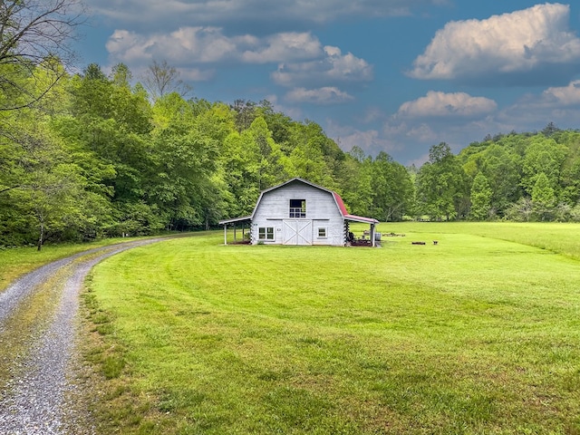 121 Farmstead Rd, Ellijay, GA 30540 - view of yard featuring a barn, a view of trees, and an outdoor structure