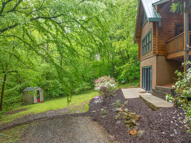121 Farmstead Rd, Ellijay, GA 30540 - view of yard featuring a view of trees, an outbuilding, and a shed