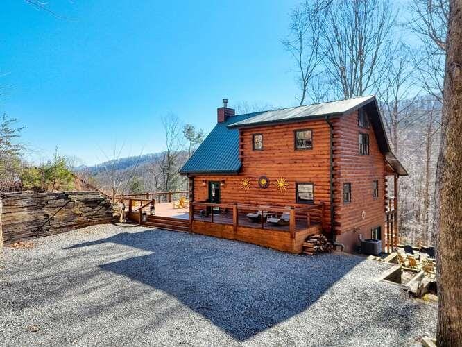 back of property featuring a wooden deck and central air condition unit