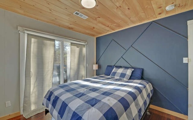 bedroom with wood ceiling and dark hardwood / wood-style floors