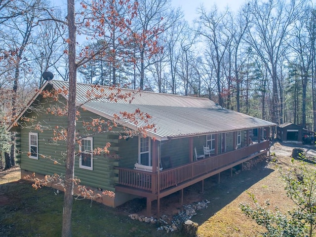 back of property featuring a wooden deck