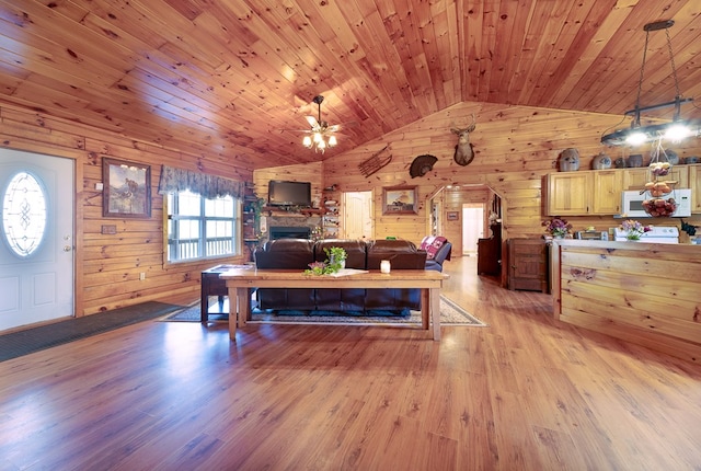 922 Liberty Cir, Murphy, NC 28906 - living area with wooden walls, a stone fireplace, light wood-style flooring, wooden ceiling, and lofted ceiling