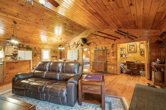 living room with ceiling fan, wood walls, light hardwood / wood-style flooring, wooden ceiling, and vaulted ceiling