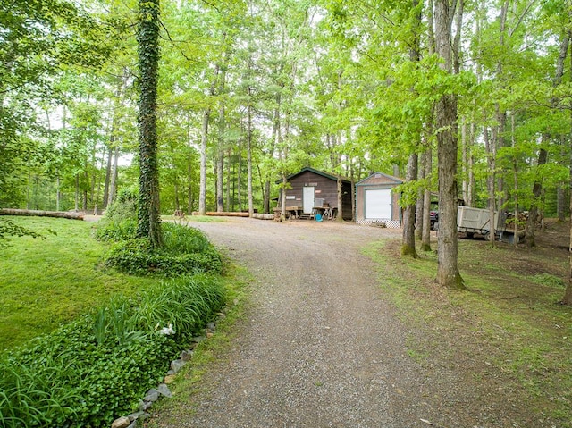 922 Liberty Cir, Murphy, NC 28906 - view of front facade with a garage, an outbuilding, and dirt driveway