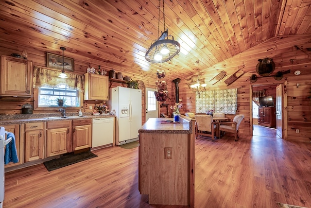 kitchen with white appliances, wooden ceiling, wooden walls, lofted ceiling, and hanging light fixtures