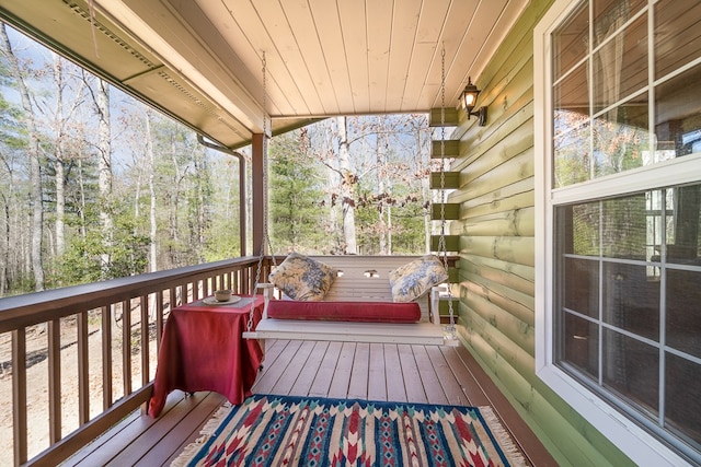 deck with a hot tub