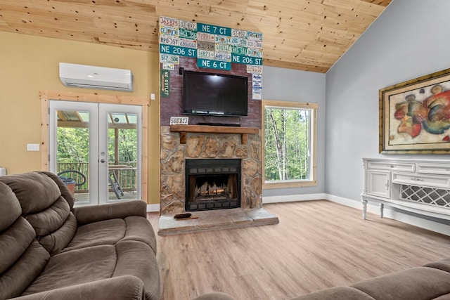 living area with an AC wall unit, vaulted ceiling, wood finished floors, wood ceiling, and baseboards
