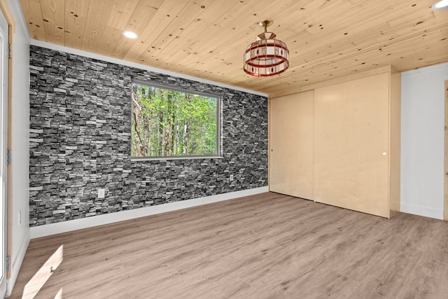 unfurnished room featuring recessed lighting, wood finished floors, baseboards, and wooden ceiling