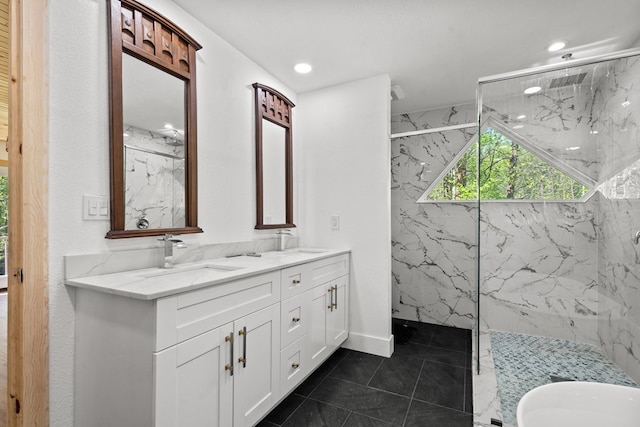 full bath featuring tile patterned floors, a marble finish shower, a sink, and double vanity