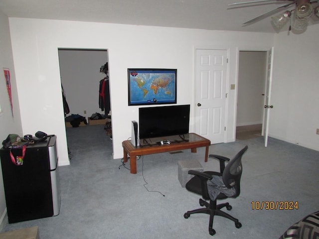 office area with light carpet and ceiling fan