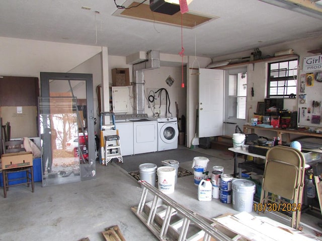 garage featuring a garage door opener and washing machine and dryer