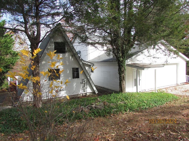 view of property exterior featuring a garage