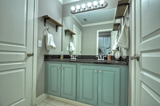 bathroom featuring crown molding, tile patterned floors, and vanity