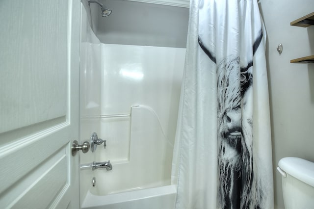 bathroom with toilet and shower / bath combo with shower curtain