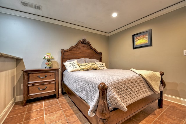 bedroom featuring tile patterned flooring and crown molding