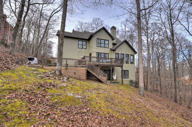 back of property featuring a deck