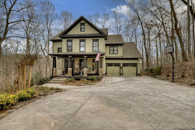 view of front of home with a porch and a garage