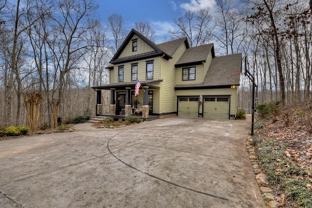 view of front facade featuring a garage and a porch