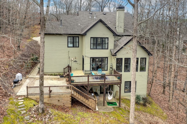 back of property with a wooden deck