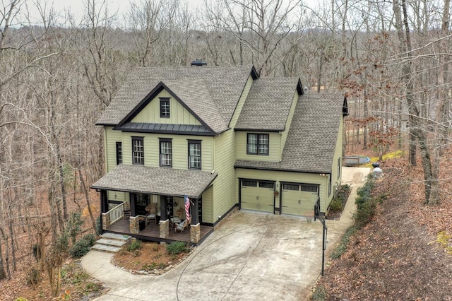 view of front of home with a porch and a garage