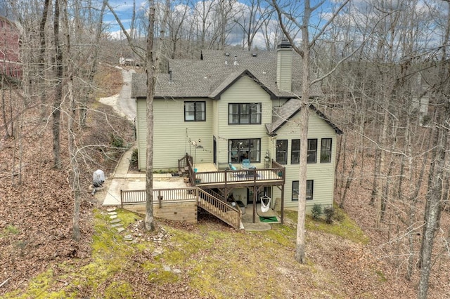 back of property featuring a wooden deck