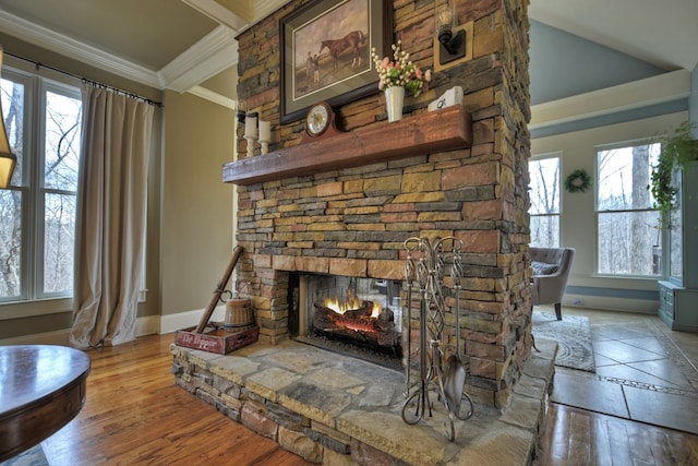 interior details with crown molding, a fireplace, beam ceiling, and hardwood / wood-style flooring