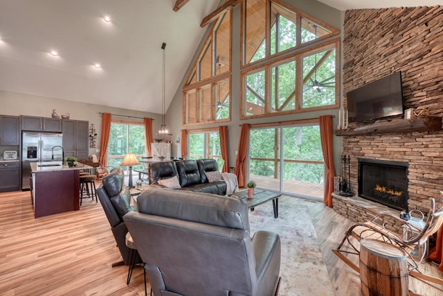 784 Sneaking Creek Dr, Hayesville, NC 28904 - living area with high vaulted ceiling, a fireplace, light wood-style flooring, and recessed lighting