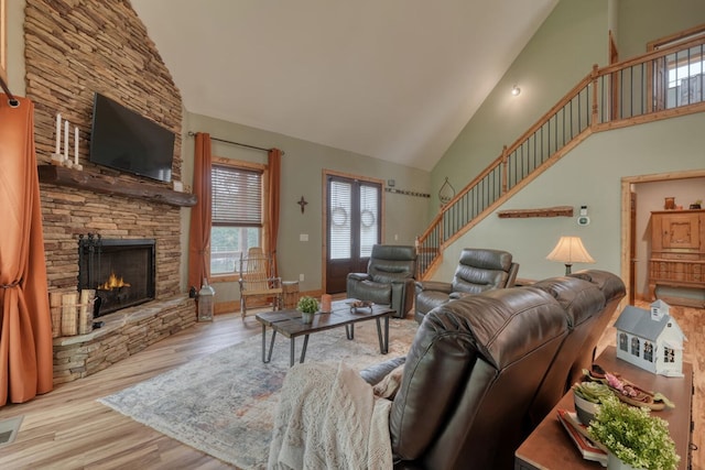 784 Sneaking Creek Dr, Hayesville, NC 28904 - living area featuring high vaulted ceiling, a fireplace, wood finished floors, and stairway