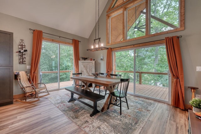 784 Sneaking Creek Dr, Hayesville, NC 28904 - dining space featuring high vaulted ceiling and light wood-style flooring