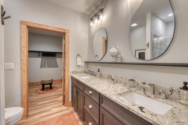 784 Sneaking Creek Dr, Hayesville, NC 28904 - full bathroom with double vanity, tiled shower, and wood finished floors