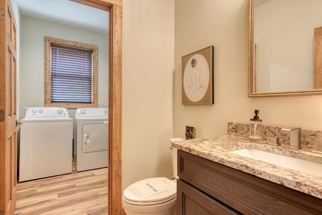 784 Sneaking Creek Dr, Hayesville, NC 28904 - bathroom with separate washer and dryer, vanity, and wood finished floors