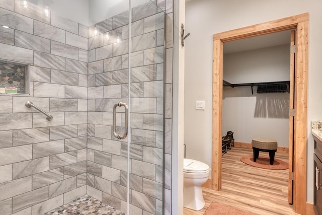 784 Sneaking Creek Dr, Hayesville, NC 28904 - bathroom with wood finished floors, a stall shower, vanity, and a spacious closet