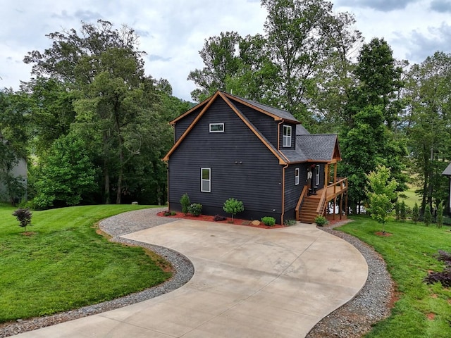 784 Sneaking Creek Dr, Hayesville, NC 28904 - view of property exterior featuring stairway, concrete driveway, and a yard