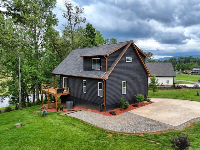 784 Sneaking Creek Dr, Hayesville, NC 28904 - back of house featuring a deck, a patio area, a yard, driveway, and roof with shingles