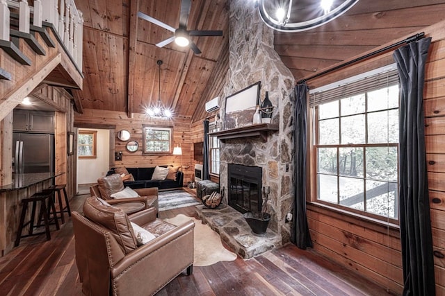 240 Donna Lee Ln, Mineral Bluff, GA 30559 - living room with wood walls, wooden ceiling, dark wood-style flooring, plenty of natural light, and a fireplace