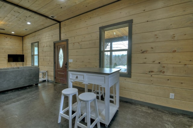 kitchen with wood ceiling and wooden walls