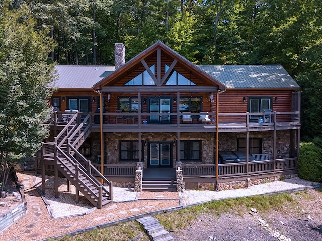 back of house with a balcony