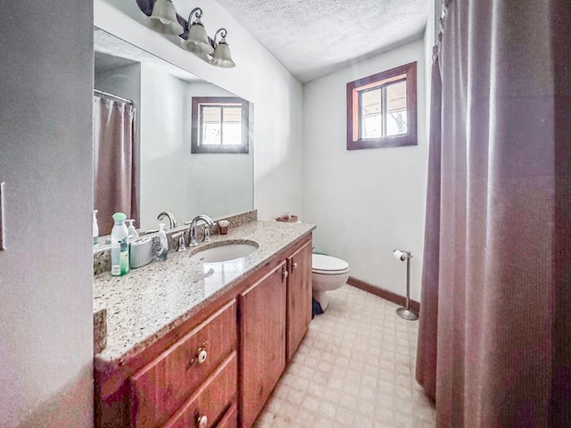 230 Tanglewood Dr, Blue Ridge, GA 30513 - bathroom with baseboards, toilet, vanity, tile patterned floors, and a textured ceiling